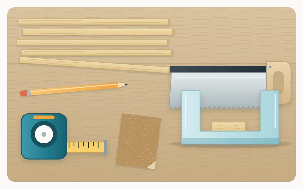 Thin pale wood strips on a workbench with a small hand saw in a miter box, a tape measure, a pencil and sandpaper