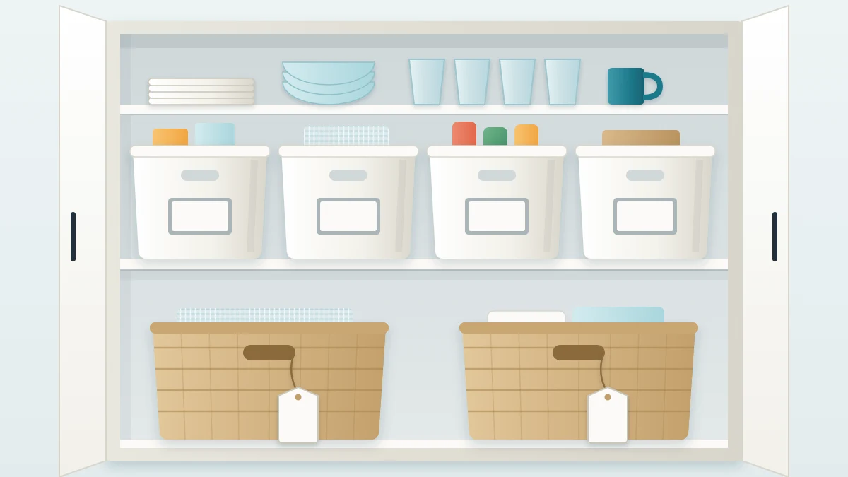Open cabinet shelf with four matching white bins, each with a small rectangular label on the front, and two baskets with tags tied to their handles