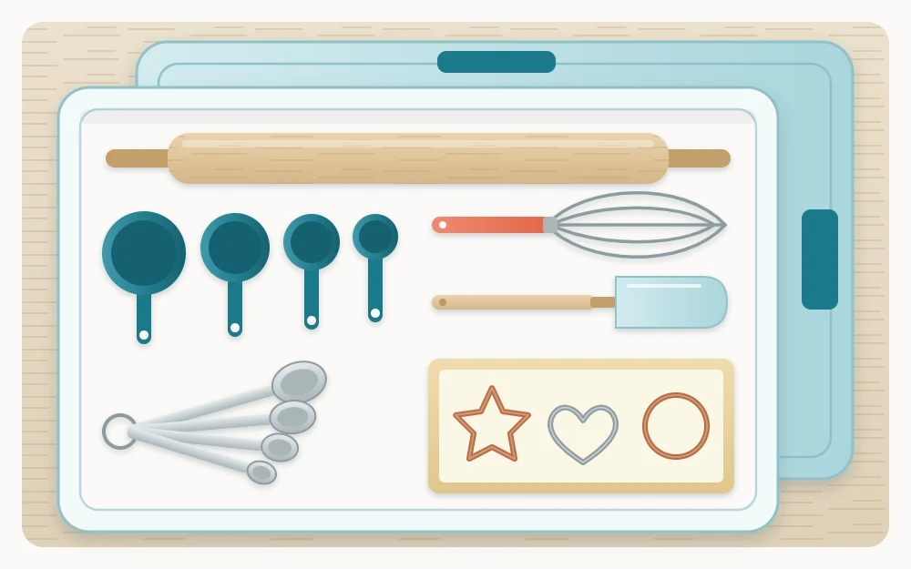 Clear lidded bin from above holding measuring cups, measuring spoons, a whisk, a spatula, a rolling pin and a small box of cookie cutters