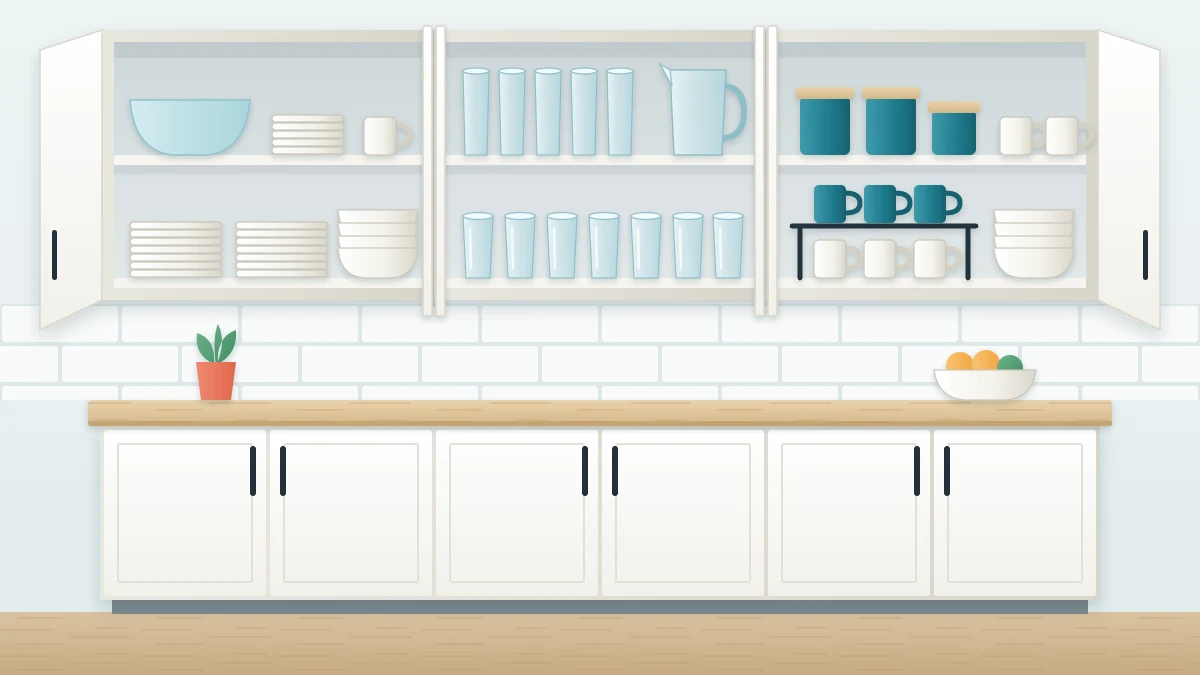 White kitchen cabinets with upper doors open showing stacked plates, rows of glasses and mugs on a shelf riser