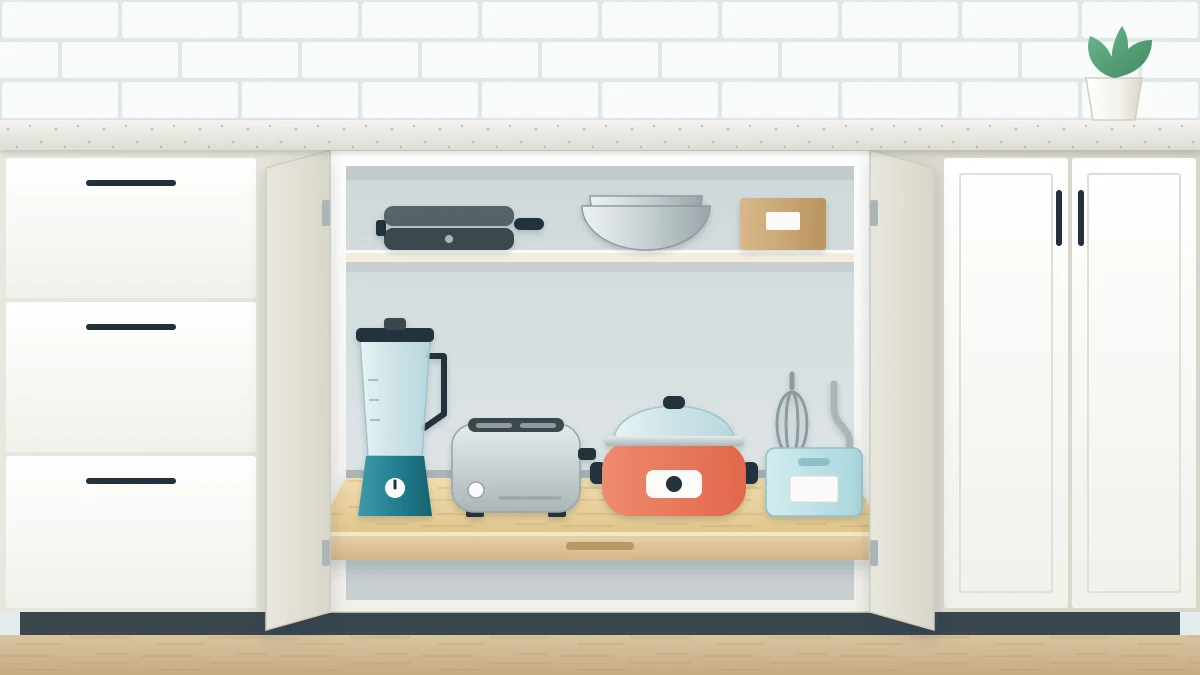A lower cabinet with open doors and an extended pull-out shelf holding a blender, a toaster and a slow cooker, with a bin of attachments and a clear countertop above